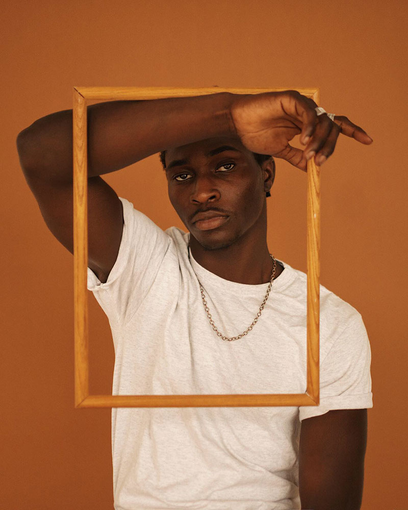 Zara Visuals photo of a male holding a frame
